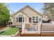Backyard with deck, turf, patio, and privacy fence at 104 Chris Ct, Cary, NC 27511