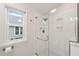 Modern bathroom with glass shower and mosaic tile at 104 Chris Ct, Cary, NC 27511