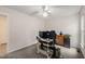 Bedroom with ceiling fan, grey carpet and home office setup at 104 Chris Ct, Cary, NC 27511