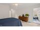 Bedroom with vaulted ceiling, wood floors, and door to sunroom at 104 Chris Ct, Cary, NC 27511