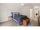 Spacious bedroom featuring vaulted ceiling, wood floors, and a comfortable bed at 104 Chris Ct, Cary, NC 27511