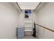 Walk-in closet with shelving, wooden rods, and extra storage space at 104 Chris Ct, Cary, NC 27511