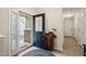 View of the home's bright entryway with a decorative front door and beautiful, light-colored laminate flooring at 104 Chris Ct, Cary, NC 27511