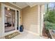 Inviting front porch with a welcome mat and blue milk jug at 104 Chris Ct, Cary, NC 27511