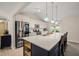 Bright, modern kitchen with stainless steel appliances, a large island, pendant lights, and ample counter space at 104 Chris Ct, Cary, NC 27511