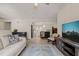 Open-concept view of the living room with access to the kitchen, fireplace, and dining room at 104 Chris Ct, Cary, NC 27511