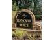 Hanover Place community sign surrounded by beautiful greenery at 104 Chris Ct, Cary, NC 27511