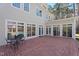 Back patio features a seating area with a table and chairs with pool views at 109 Chimeneas Pl, Chapel Hill, NC 27517