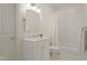 White bathroom featuring a vanity with marble countertop, a tiled shower-tub combo, and neutral finishes at 109 Chimeneas Pl, Chapel Hill, NC 27517