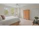 Cozy bedroom featuring carpet, closet, and natural light, creating a warm and inviting space at 109 Chimeneas Pl, Chapel Hill, NC 27517
