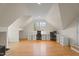 Large bonus room featuring hardwood floors and built in desk at 109 Chimeneas Pl, Chapel Hill, NC 27517