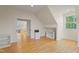 Another angle of the bonus room with hardwood floors at 109 Chimeneas Pl, Chapel Hill, NC 27517