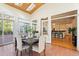Inviting breakfast nook features a table set for four with view of the gourmet kitchen at 109 Chimeneas Pl, Chapel Hill, NC 27517
