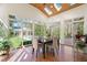 Lovely breakfast nook with skylights, terra cotta floors, and a view of the backyard and pool at 109 Chimeneas Pl, Chapel Hill, NC 27517