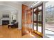 Grand foyer with a wood front door, sidelights, and views into the home's interior and exterior at 109 Chimeneas Pl, Chapel Hill, NC 27517