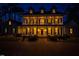 Exterior shot of home with a wide porch, symmetrical design and brick driveway at 109 Chimeneas Pl, Chapel Hill, NC 27517