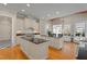 Bright eat-in kitchen with double islands, granite counters, and stainless steel appliances at 109 Chimeneas Pl, Chapel Hill, NC 27517