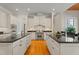 Well-appointed kitchen with double islands, stainless steel appliances, and hardwood floors at 109 Chimeneas Pl, Chapel Hill, NC 27517