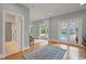 Open living area with hardwood floors, natural light, and views of the pool and backyard at 109 Chimeneas Pl, Chapel Hill, NC 27517