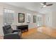 Comfortable living room with hardwood floors, a ceiling fan and balcony access at 109 Chimeneas Pl, Chapel Hill, NC 27517