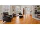 Elegant living room featuring hardwood floors, a fireplace, and comfortable seating area with lots of natural light at 109 Chimeneas Pl, Chapel Hill, NC 27517