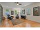 Bright and spacious living room with hardwood floors and natural light from multiple windows at 109 Chimeneas Pl, Chapel Hill, NC 27517
