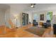 Cozy living room with a guitar, bookshelves, ceiling fan and comfortable seating at 109 Chimeneas Pl, Chapel Hill, NC 27517