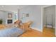 Spacious living room featuring hardwood floors, light-colored walls, a fireplace, and large windows at 109 Chimeneas Pl, Chapel Hill, NC 27517