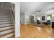 Inviting living room showcasing hardwood floors, staircase, and cozy seating area at 109 Chimeneas Pl, Chapel Hill, NC 27517