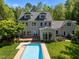 Rear view of home with a swimming pool at 109 Chimeneas Pl, Chapel Hill, NC 27517
