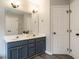 Bathroom features a double sink vanity, and a closet at 110 Forest Run Pl, Cary, NC 27518