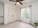 Bright bedroom features a closet, curtains, and a large window to let in natural light at 110 Forest Run Pl, Cary, NC 27518