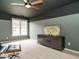 Bedroom with two-tone walls, a map art piece, modern furniture, and a window for natural light at 110 Forest Run Pl, Cary, NC 27518