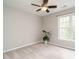 Neutral bedroom featuring a ceiling fan, plant near window, and neutral carpet at 110 Forest Run Pl, Cary, NC 27518
