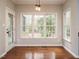 Bright dining area with hardwood floors, flooded with natural light from the large windows at 110 Forest Run Pl, Cary, NC 27518