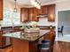 Well-equipped kitchen with hardwood floors, granite countertops, and a center island with seating at 110 Forest Run Pl, Cary, NC 27518