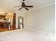 Living room with neutral carpet leads to an arched entry, showcasing the home's open floor plan and access to the kitchen at 110 Forest Run Pl, Cary, NC 27518