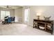 Spacious living room featuring neutral carpet, modern furnishings, and ample natural light at 110 Forest Run Pl, Cary, NC 27518