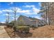 Exterior view of a well-maintained backyard with a tidy lawn and mature landscaping at 110 Gulley Glen Dr, Garner, NC 27529