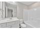 Clean, well-lit bathroom with a white vanity, toilet, and shower-tub combination at 110 Gulley Glen Dr, Garner, NC 27529