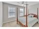 Cozy bedroom featuring a four-poster bed, soft bedding, and natural light at 110 Gulley Glen Dr, Garner, NC 27529