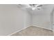 Neutral bedroom with a ceiling fan, carpet, and ample natural light at 110 Gulley Glen Dr, Garner, NC 27529