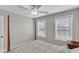 Bright bedroom with soft lighting featuring a four-poster bed and neutral decor at 110 Gulley Glen Dr, Garner, NC 27529