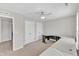 Well-lit bedroom with two closets, a ceiling fan, and a spacious desk at 110 Gulley Glen Dr, Garner, NC 27529