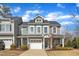 Beautiful two-story home featuring a white garage door, front porch, and manicured landscaping at 110 Gulley Glen Dr, Garner, NC 27529