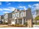 Charming townhome with a well-kept lawn, inviting front porch, and classic architectural details at 110 Gulley Glen Dr, Garner, NC 27529