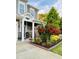 Charming front porch with inviting decor and colorful landscaping, creating a warm welcome to the home at 110 Gulley Glen Dr, Garner, NC 27529