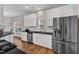 Spacious kitchen features stainless steel appliances, double door fridge and ample cabinets at 110 Gulley Glen Dr, Garner, NC 27529