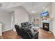 Bright living room with vaulted ceiling, fan, fireplace and access to yard at 110 Gulley Glen Dr, Garner, NC 27529