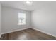 Bedroom with neutral walls, hardwood floors, and window with outside view at 111 Hickory Plains Rd, Knightdale, NC 27545